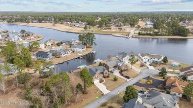 Experience resort-style living in this stunning waterfront home on Harbour Point Golf Club in North Carolina - for sale on GolfHomes.com, golf home, golf lot