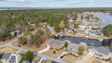Experience resort-style living in this stunning waterfront home on Harbour Point Golf Club in North Carolina - for sale on GolfHomes.com, golf home, golf lot