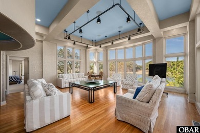 Bold in design and unmistakable in presence, this custom-built on The Currituck Golf Club in North Carolina - for sale on GolfHomes.com, golf home, golf lot