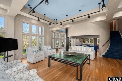 Bold in design and unmistakable in presence, this custom-built on The Currituck Golf Club in North Carolina - for sale on GolfHomes.com, golf home, golf lot