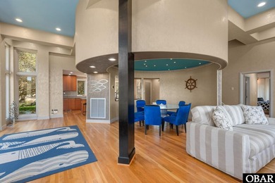 Bold in design and unmistakable in presence, this custom-built on The Currituck Golf Club in North Carolina - for sale on GolfHomes.com, golf home, golf lot