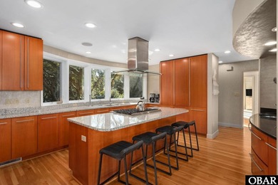 Bold in design and unmistakable in presence, this custom-built on The Currituck Golf Club in North Carolina - for sale on GolfHomes.com, golf home, golf lot