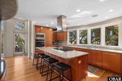 Bold in design and unmistakable in presence, this custom-built on The Currituck Golf Club in North Carolina - for sale on GolfHomes.com, golf home, golf lot