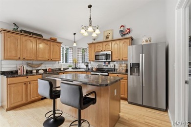 Wake up each morning to the peaceful sounds of hummingbirds and on Raintree Country Club in Missouri - for sale on GolfHomes.com, golf home, golf lot