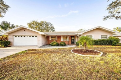 See this stately 4-bedroom, 3-bath home in the highly on The Dunedin Country Club in Florida - for sale on GolfHomes.com, golf home, golf lot