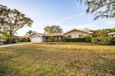 See this stately 4-bedroom, 3-bath home in the highly on The Dunedin Country Club in Florida - for sale on GolfHomes.com, golf home, golf lot