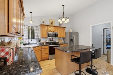 Wake up each morning to the peaceful sounds of hummingbirds and on Raintree Country Club in Missouri - for sale on GolfHomes.com, golf home, golf lot