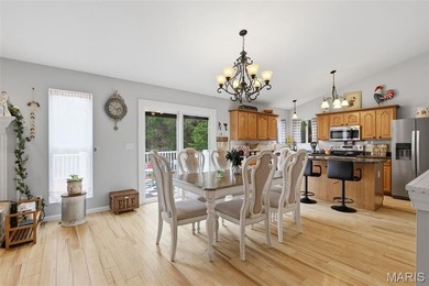 Wake up each morning to the peaceful sounds of hummingbirds and on Raintree Country Club in Missouri - for sale on GolfHomes.com, golf home, golf lot