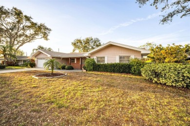 See this stately 4-bedroom, 3-bath home in the highly on The Dunedin Country Club in Florida - for sale on GolfHomes.com, golf home, golf lot