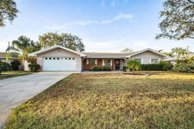 See this stately 4-bedroom, 3-bath home in the highly on The Dunedin Country Club in Florida - for sale on GolfHomes.com, golf home, golf lot