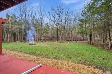 Wake up each morning to the peaceful sounds of hummingbirds and on Raintree Country Club in Missouri - for sale on GolfHomes.com, golf home, golf lot