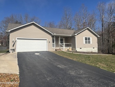 Welcome to this spacious 1500+ sq ft one owner home in Lake on Lake Tansi Village Country Club in Tennessee - for sale on GolfHomes.com, golf home, golf lot