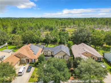Nestled on a 1/4-acre homesite backing up to a natural area on Victoria Hills Golf Club in Florida - for sale on GolfHomes.com, golf home, golf lot