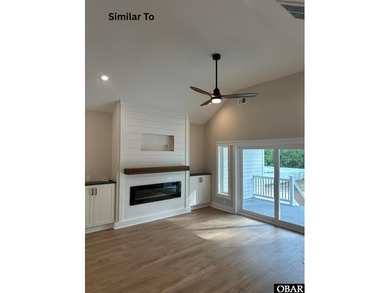 Experience the perfect blend of timeless architecture and on The Currituck Golf Club in North Carolina - for sale on GolfHomes.com, golf home, golf lot