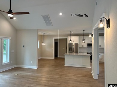 Experience the perfect blend of timeless architecture and on The Currituck Golf Club in North Carolina - for sale on GolfHomes.com, golf home, golf lot