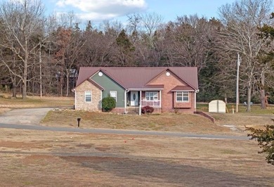 Spacious 5-bedroom, 3-bath home in Diamond City, AR offering 4 on Diamond Hills Country Club in Arkansas - for sale on GolfHomes.com, golf home, golf lot