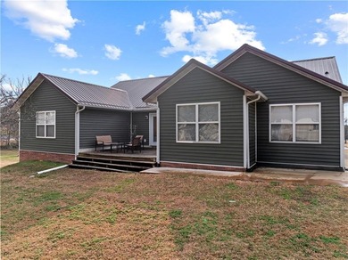 Spacious 5-bedroom, 3-bath home in Diamond City, AR offering 4 on Diamond Hills Country Club in Arkansas - for sale on GolfHomes.com, golf home, golf lot