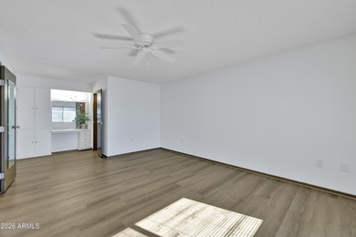 Beautifully updated patio-style townhouse offering modern on PalmBrook Country Club in Arizona - for sale on GolfHomes.com, golf home, golf lot