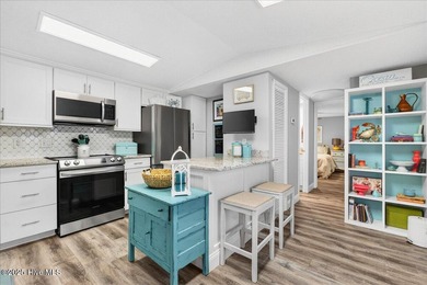 Located in the sought after neighborhood of Seaside Station with on Oyster Bay Golf Links in North Carolina - for sale on GolfHomes.com, golf home, golf lot