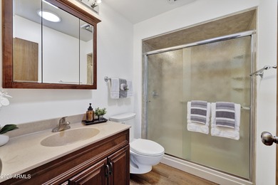 Beautifully updated patio-style townhouse offering modern on PalmBrook Country Club in Arizona - for sale on GolfHomes.com, golf home, golf lot