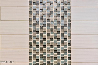 Located in the sought after neighborhood of Seaside Station with on Oyster Bay Golf Links in North Carolina - for sale on GolfHomes.com, golf home, golf lot