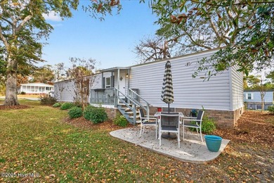 Located in the sought after neighborhood of Seaside Station with on Oyster Bay Golf Links in North Carolina - for sale on GolfHomes.com, golf home, golf lot