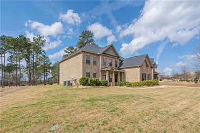 Welcome to 6857 Louis Drive, a beautiful all-brick home located on Canongate At Heron Bay in Georgia - for sale on GolfHomes.com, golf home, golf lot
