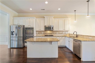 Welcome to 6857 Louis Drive, a beautiful all-brick home located on Canongate At Heron Bay in Georgia - for sale on GolfHomes.com, golf home, golf lot