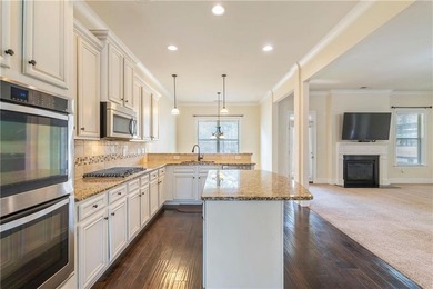 Welcome to 6857 Louis Drive, a beautiful all-brick home located on Canongate At Heron Bay in Georgia - for sale on GolfHomes.com, golf home, golf lot