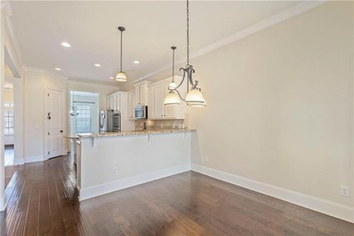 Welcome to 6857 Louis Drive, a beautiful all-brick home located on Canongate At Heron Bay in Georgia - for sale on GolfHomes.com, golf home, golf lot