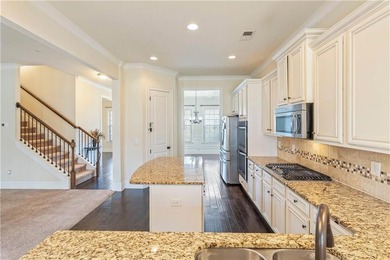 Welcome to 6857 Louis Drive, a beautiful all-brick home located on Canongate At Heron Bay in Georgia - for sale on GolfHomes.com, golf home, golf lot