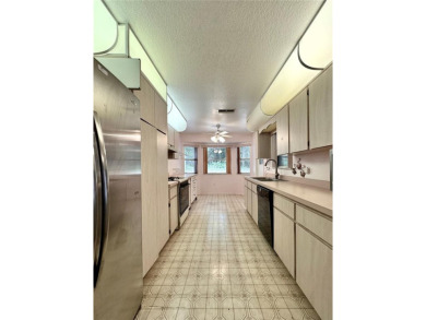 This 3-bedroom, 2-bath block home in Citrus Springs is exactly on Citrus Springs Country Club in Florida - for sale on GolfHomes.com, golf home, golf lot