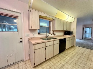 This 3-bedroom, 2-bath block home in Citrus Springs is exactly on Citrus Springs Country Club in Florida - for sale on GolfHomes.com, golf home, golf lot
