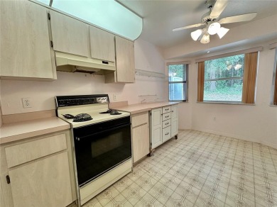 This 3-bedroom, 2-bath block home in Citrus Springs is exactly on Citrus Springs Country Club in Florida - for sale on GolfHomes.com, golf home, golf lot