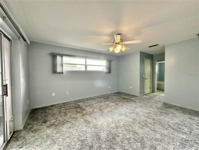 This 3-bedroom, 2-bath block home in Citrus Springs is exactly on Citrus Springs Country Club in Florida - for sale on GolfHomes.com, golf home, golf lot