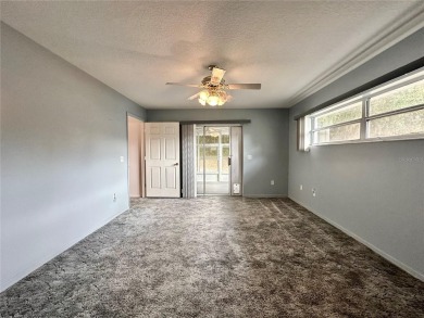 This 3-bedroom, 2-bath block home in Citrus Springs is exactly on Citrus Springs Country Club in Florida - for sale on GolfHomes.com, golf home, golf lot