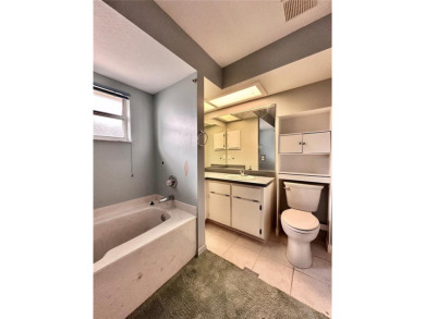 This 3-bedroom, 2-bath block home in Citrus Springs is exactly on Citrus Springs Country Club in Florida - for sale on GolfHomes.com, golf home, golf lot