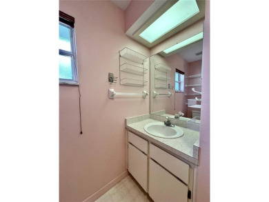 This 3-bedroom, 2-bath block home in Citrus Springs is exactly on Citrus Springs Country Club in Florida - for sale on GolfHomes.com, golf home, golf lot