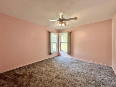 This 3-bedroom, 2-bath block home in Citrus Springs is exactly on Citrus Springs Country Club in Florida - for sale on GolfHomes.com, golf home, golf lot