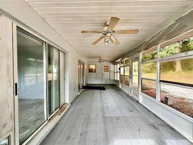 This 3-bedroom, 2-bath block home in Citrus Springs is exactly on Citrus Springs Country Club in Florida - for sale on GolfHomes.com, golf home, golf lot