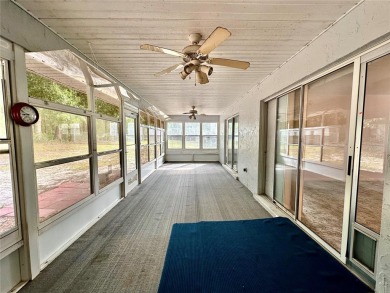 This 3-bedroom, 2-bath block home in Citrus Springs is exactly on Citrus Springs Country Club in Florida - for sale on GolfHomes.com, golf home, golf lot