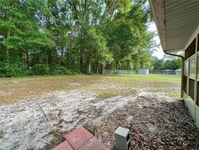 This 3-bedroom, 2-bath block home in Citrus Springs is exactly on Citrus Springs Country Club in Florida - for sale on GolfHomes.com, golf home, golf lot
