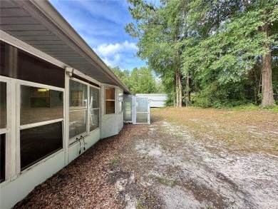 This 3-bedroom, 2-bath block home in Citrus Springs is exactly on Citrus Springs Country Club in Florida - for sale on GolfHomes.com, golf home, golf lot