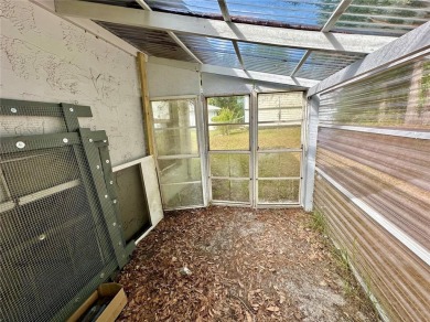 This 3-bedroom, 2-bath block home in Citrus Springs is exactly on Citrus Springs Country Club in Florida - for sale on GolfHomes.com, golf home, golf lot
