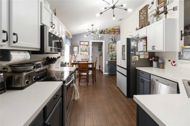 Welcome to this beautifully maintained 4-bedroom, 2-bathroom on Royal St. Cloud Golf Links in Florida - for sale on GolfHomes.com, golf home, golf lot