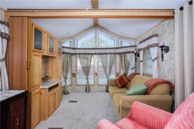 Discover cozy comfort in this beautifully maintained 1-bedroom on Beaver Dam Resort in Arizona - for sale on GolfHomes.com, golf home, golf lot