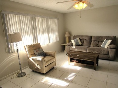 TURNKEY 1 BEDROOM, 1.5 BATHS. TILE IN LIVING AREAS, CARPET IN on Wynmoor Golf Course in Florida - for sale on GolfHomes.com, golf home, golf lot