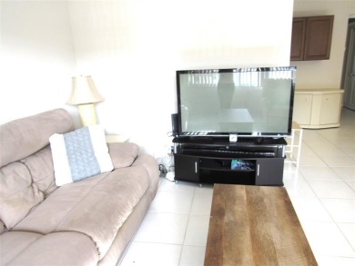 TURNKEY 1 BEDROOM, 1.5 BATHS. TILE IN LIVING AREAS, CARPET IN on Wynmoor Golf Course in Florida - for sale on GolfHomes.com, golf home, golf lot