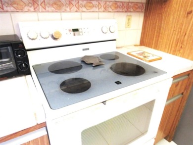 TURNKEY 1 BEDROOM, 1.5 BATHS. TILE IN LIVING AREAS, CARPET IN on Wynmoor Golf Course in Florida - for sale on GolfHomes.com, golf home, golf lot