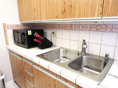 TURNKEY 1 BEDROOM, 1.5 BATHS. TILE IN LIVING AREAS, CARPET IN on Wynmoor Golf Course in Florida - for sale on GolfHomes.com, golf home, golf lot